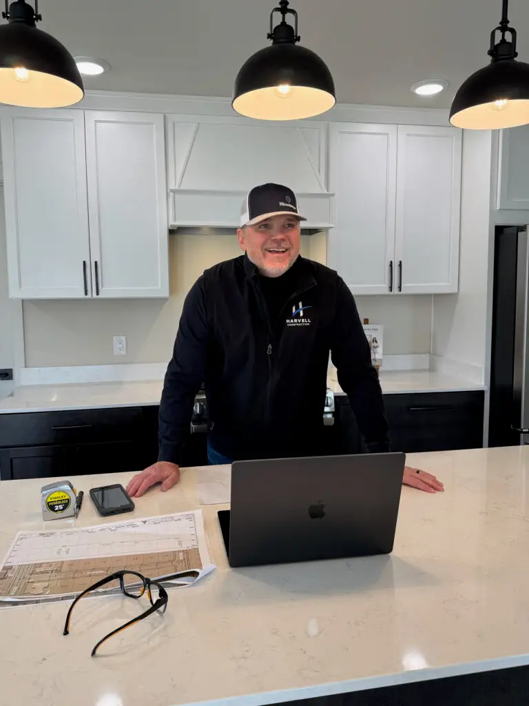 Chad Harvell of Harvell Homes stands in a custom kitchen built by his construction company.