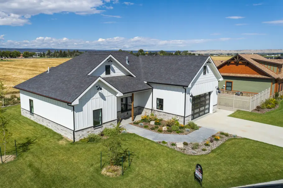 Exterior view of 800 N Clark Ave in Powell Wyoming with fields in the background built by Harvell Homes