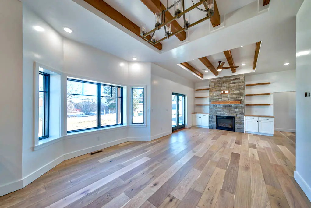 Interior photo of custom-built home by Harvell Homes in Powell, Wyoming featuring the living room, fireplace, and dining area