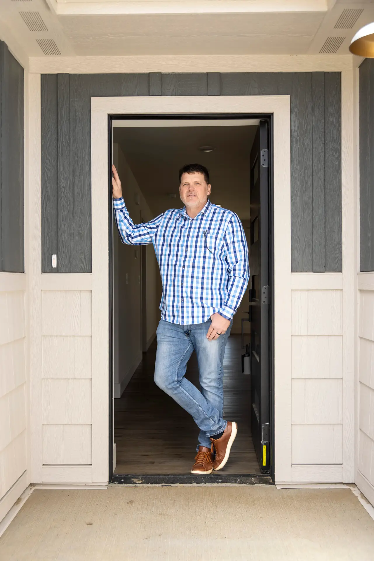 Chad Harvell stands in one of the Harvell builds at Cottonwood Village.