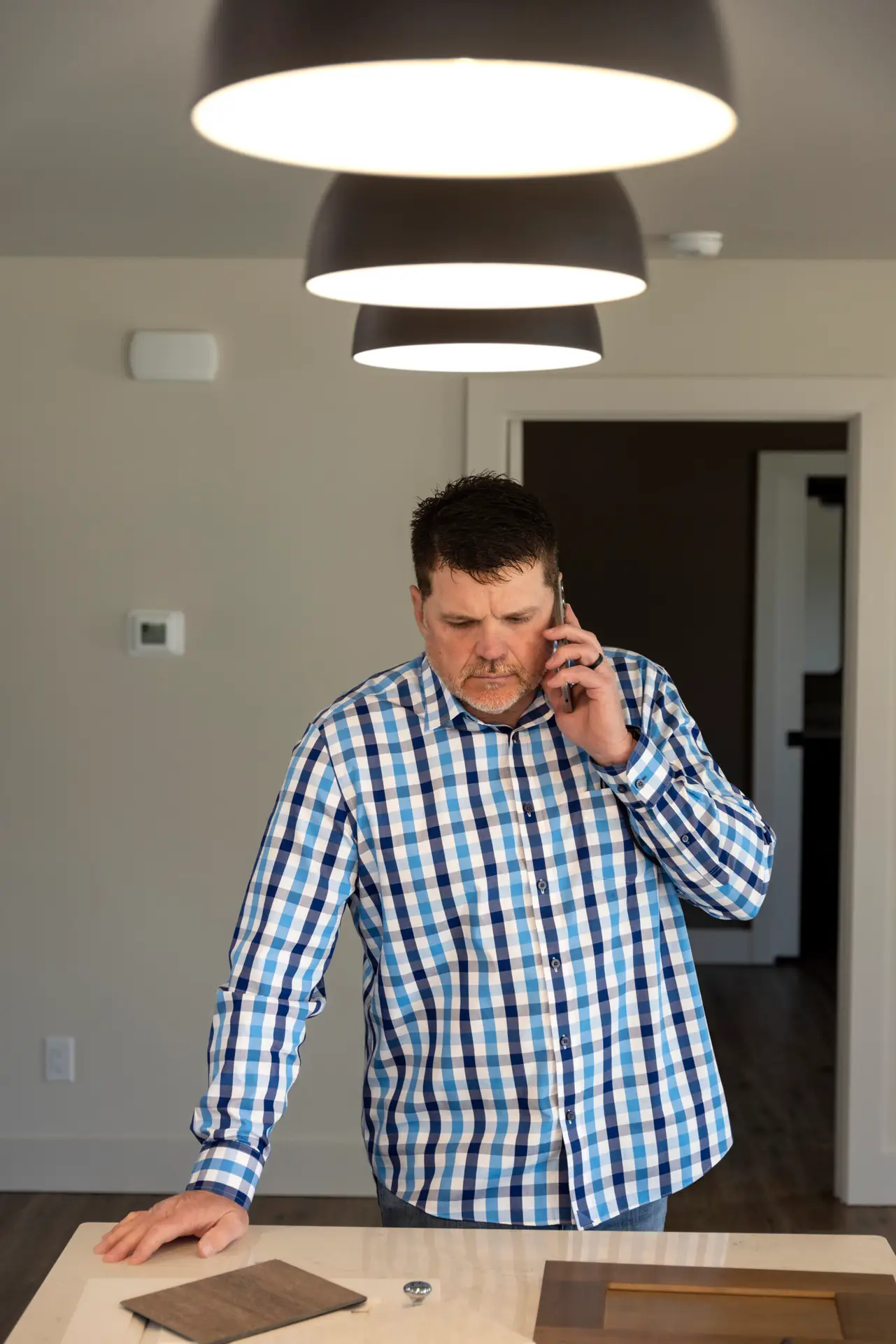 Chad Harvell speaks with client on the phone.